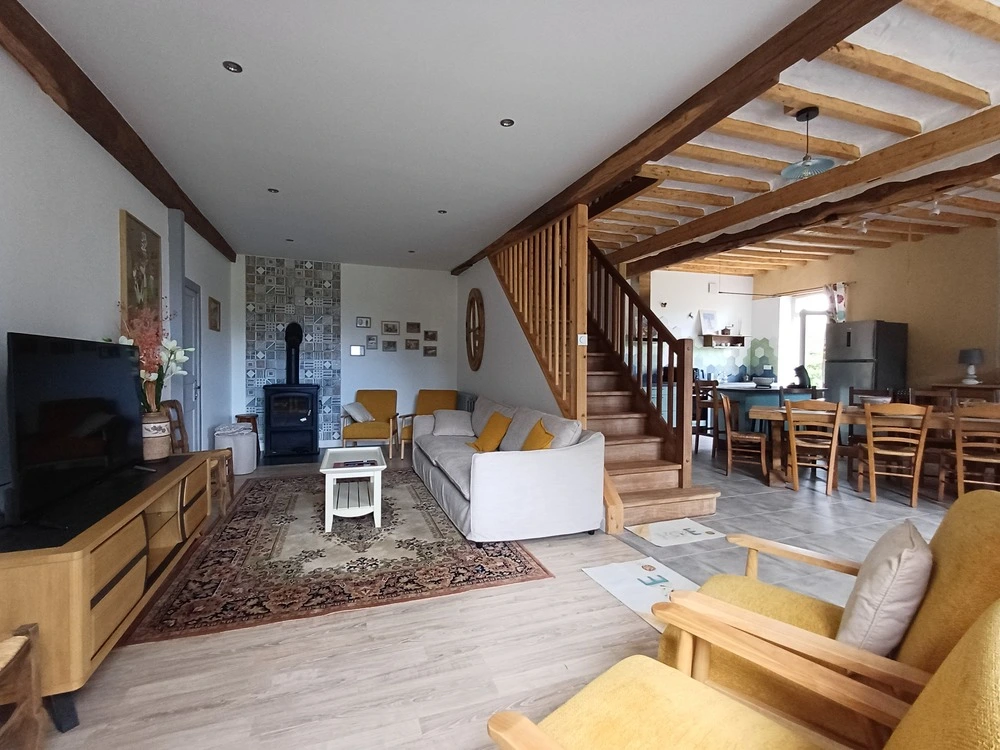 Salon familial et cosy au rez-de-chaussée du Gîte la Méniquette